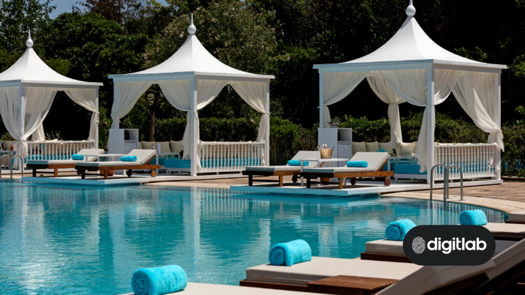Best marketing practices for hotels - photo of a hotel swimming pool with reclining chairs.