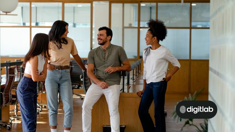 Common startup mistakes - team of startup staff chatting around a desk.