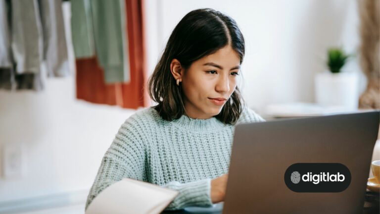 Startup marketing strategy - woman sitting behind laptop.